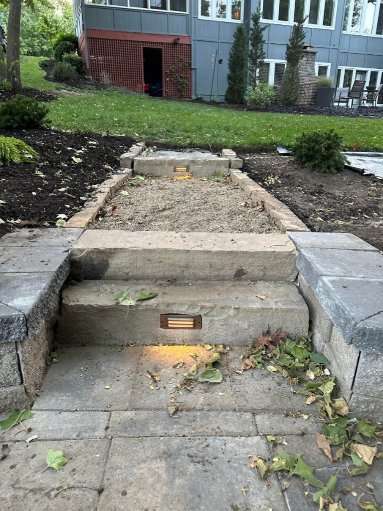 Stone stairway renovation project with new paver installation in Kansas City
