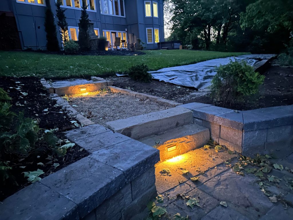 Stone steps with built-in landscape lighting at residential project in Kansas City