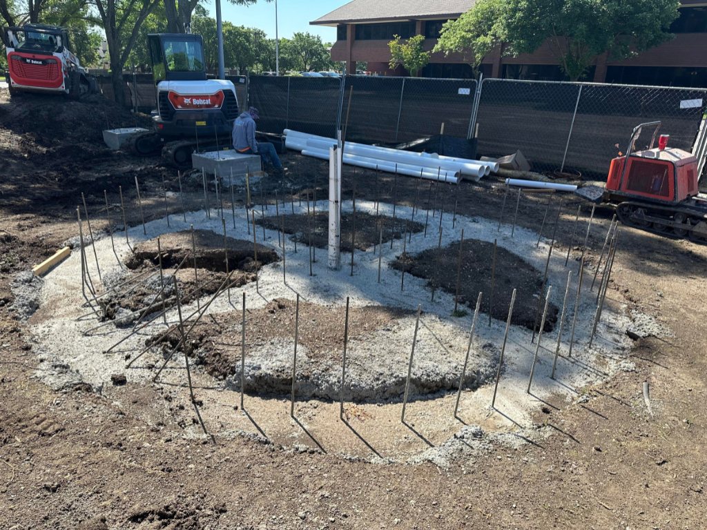 Excavated circular base prepared for custom stone patio in Kansas City